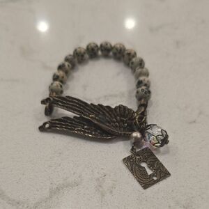 Elegant Beaded Bracelet with Charms